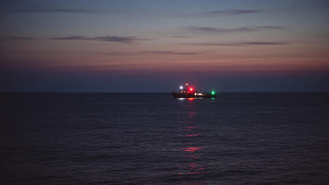 Distant navigation lights on dark water