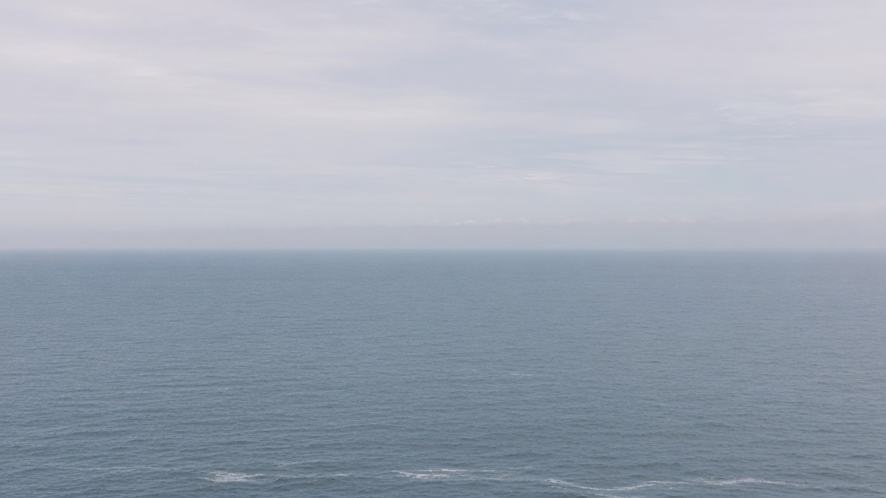 Overcast North Sea horizon. No people, no weapons.